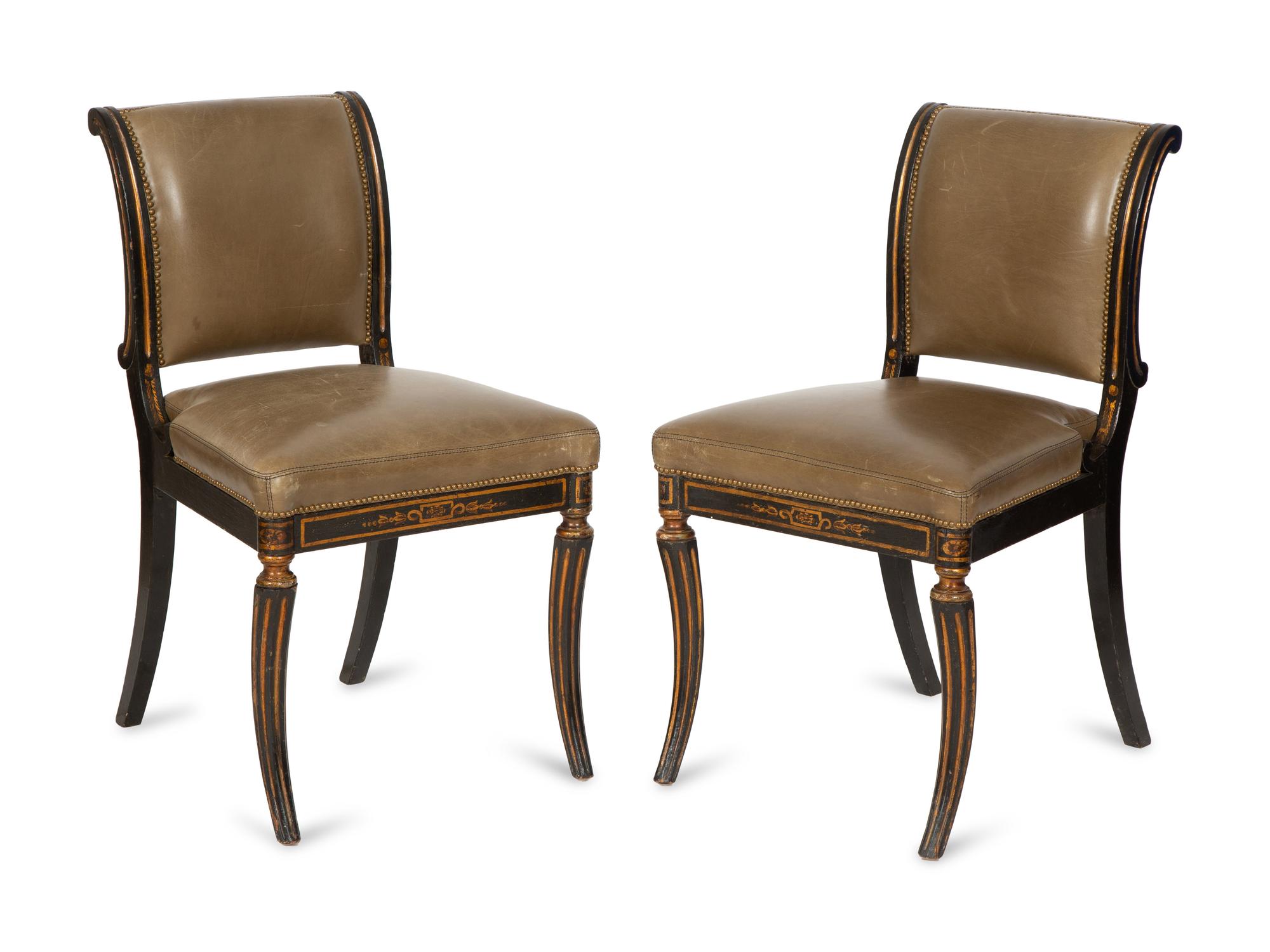 A Set of Four English Regency Style Ebonized and Parcel Gilt Mahogany Dining Chairs