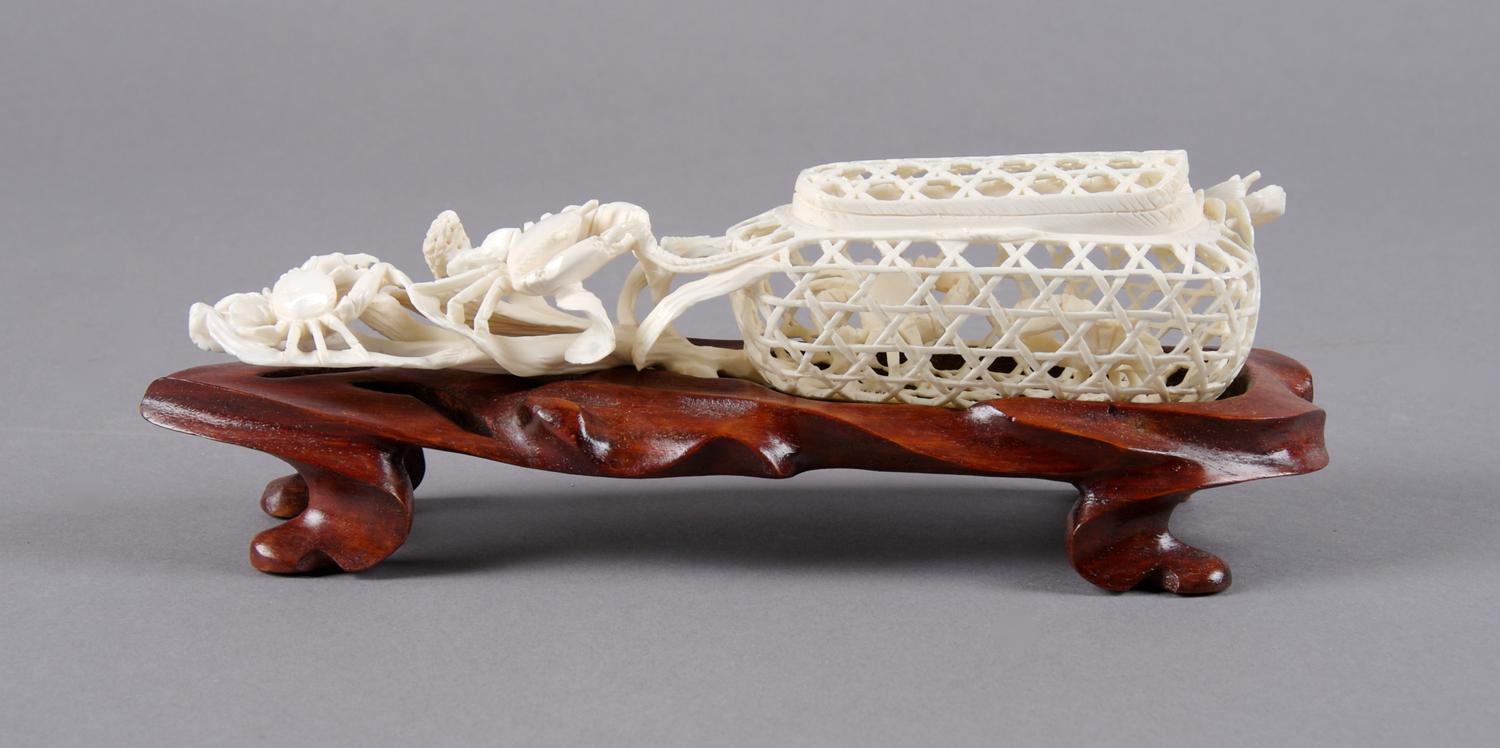 An Asian Ivory Carving of a Crab Cage, Length 8 1/4 inches.
