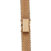 OLGA TRITT, YELLOW GOLD AND DIAMOND SURPRISE WATCH
