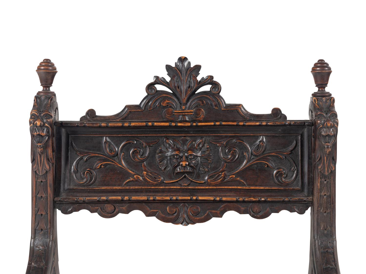 An Italian Renaissance Revival Carved Walnut Savonarola Chair
