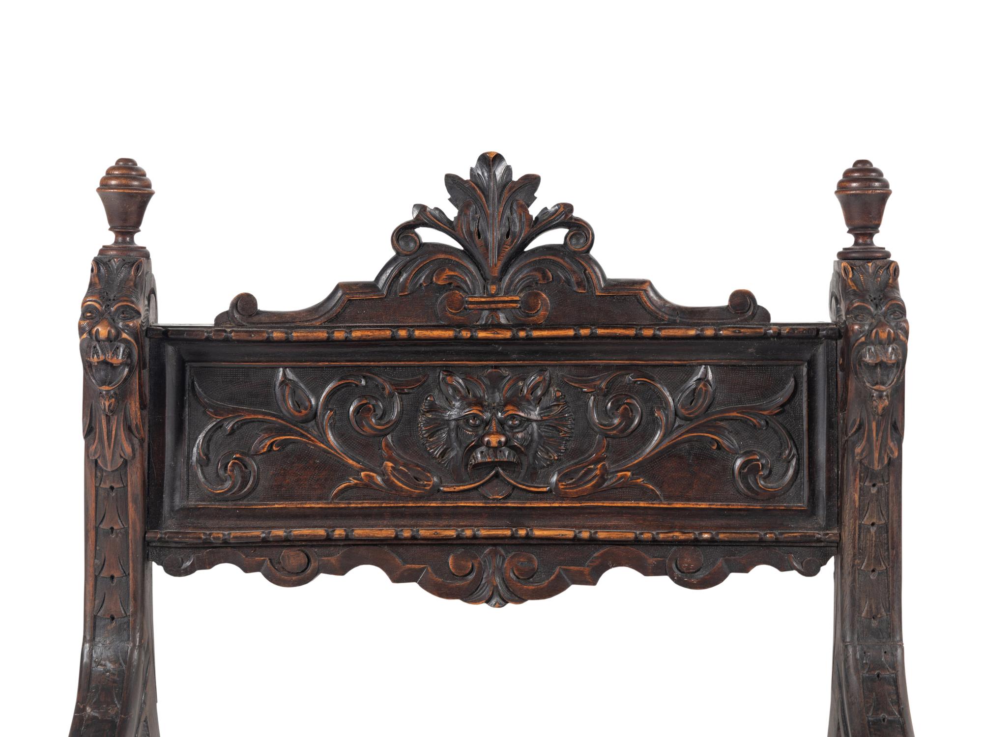 An Italian Renaissance Revival Carved Walnut Savonarola Chair