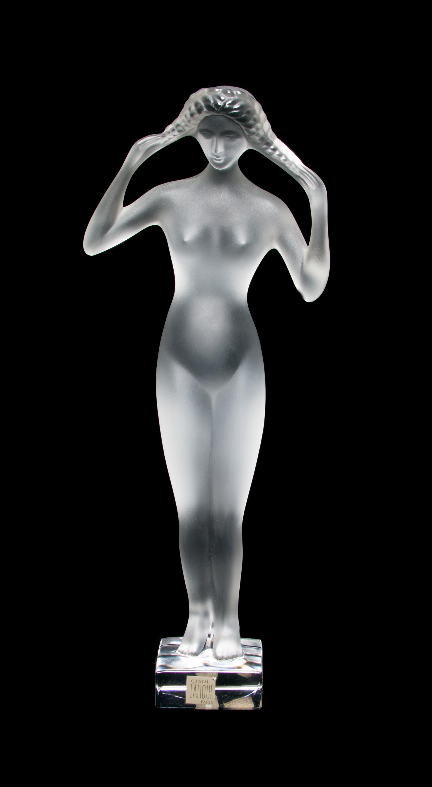A Lalique Molded and Frosted Glass Figure Height 13 3/4 inches.