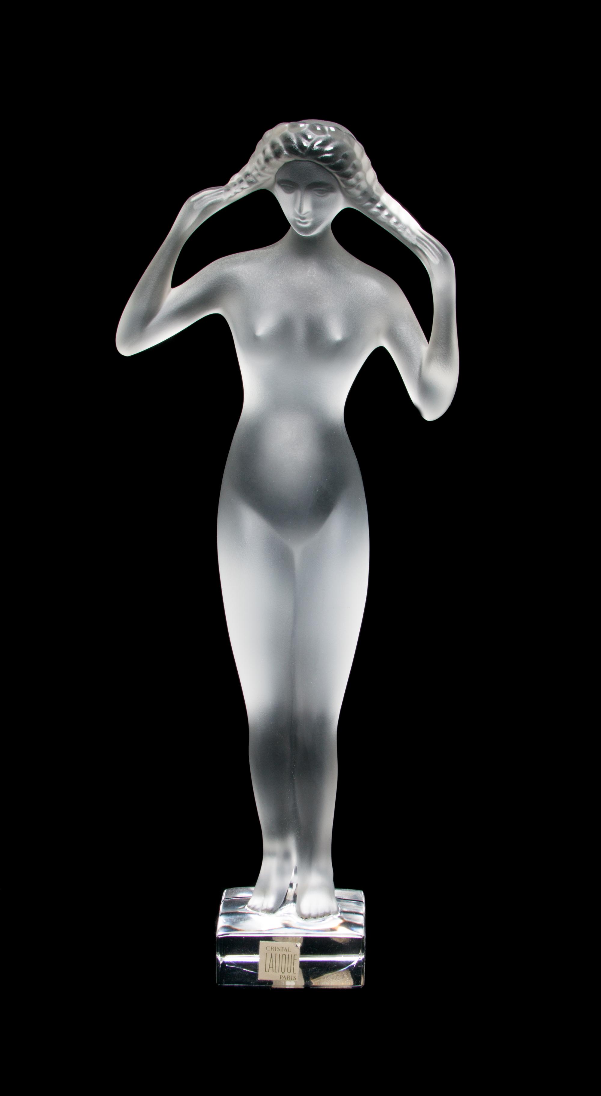 A Lalique Molded and Frosted Glass Figure Height 13 3/4 inches.