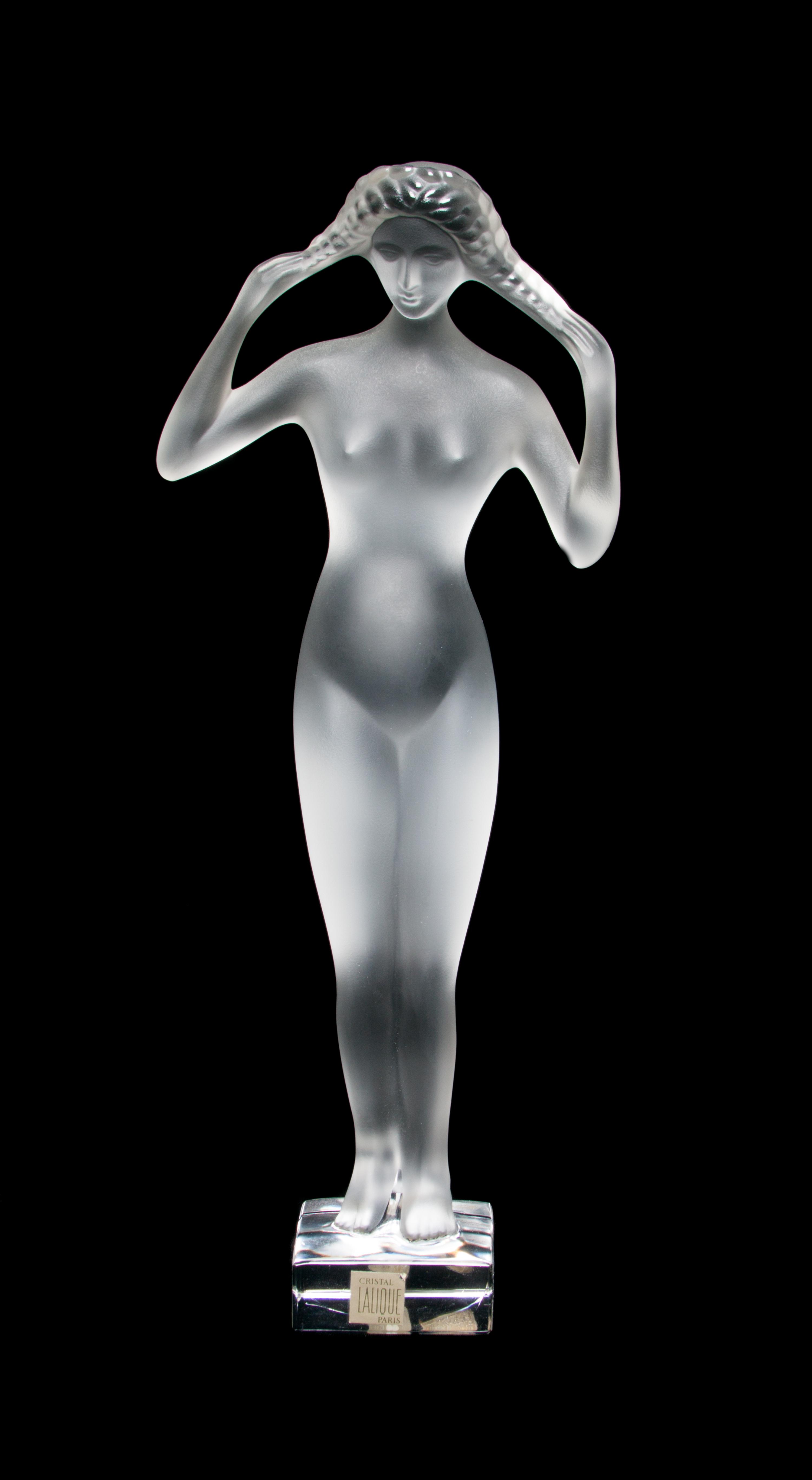 A Lalique Molded and Frosted Glass Figure Height 13 3/4 inches.