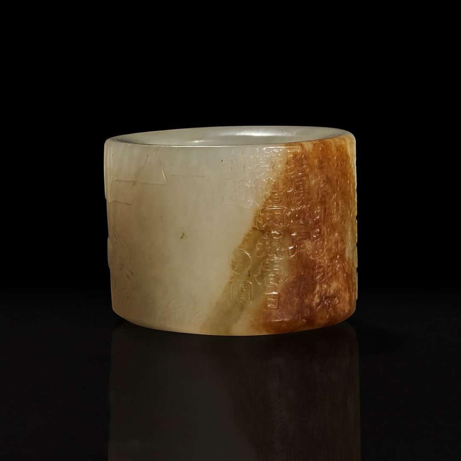A large pale celadon and russet jade archer ring with Imperial poem and hunting scene 乾隆御题诗狩猎图玉扳指 Qing Dynasty ?