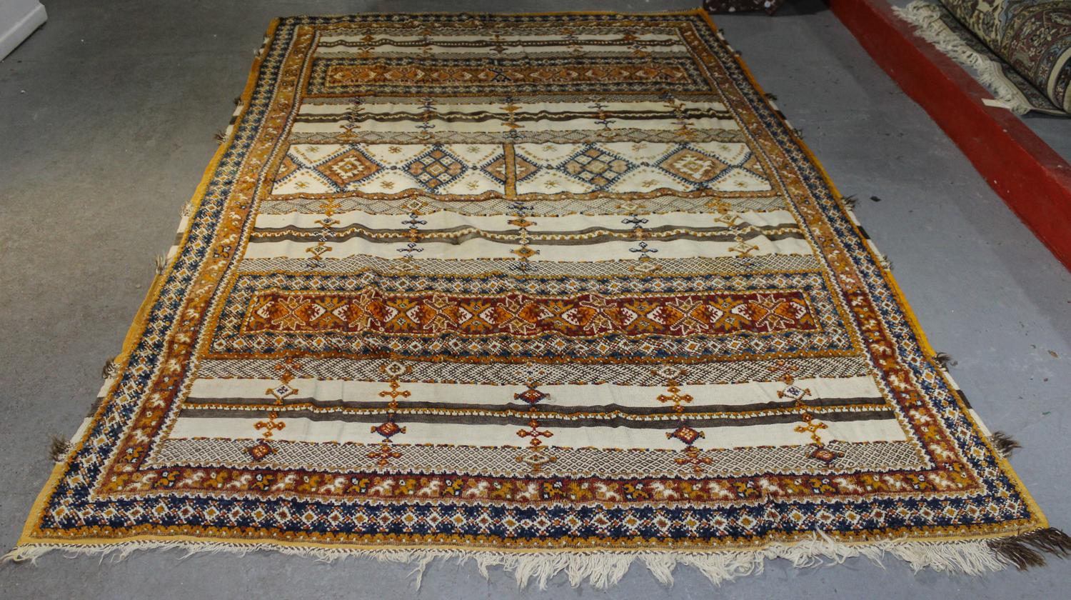A Moroccan Wool Rug 8 feet 10 inches x 6 feet 8 inches. — SECOND HALF 20TH CENTURY