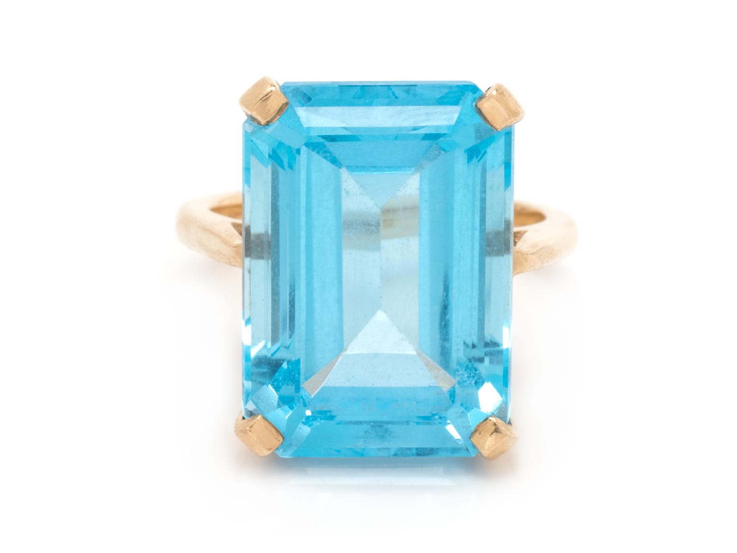A 14 Karat Yellow Gold and Topaz Ring,