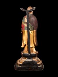 A Polychrome and Gilt Painted Wood Figure of a Standing Monk