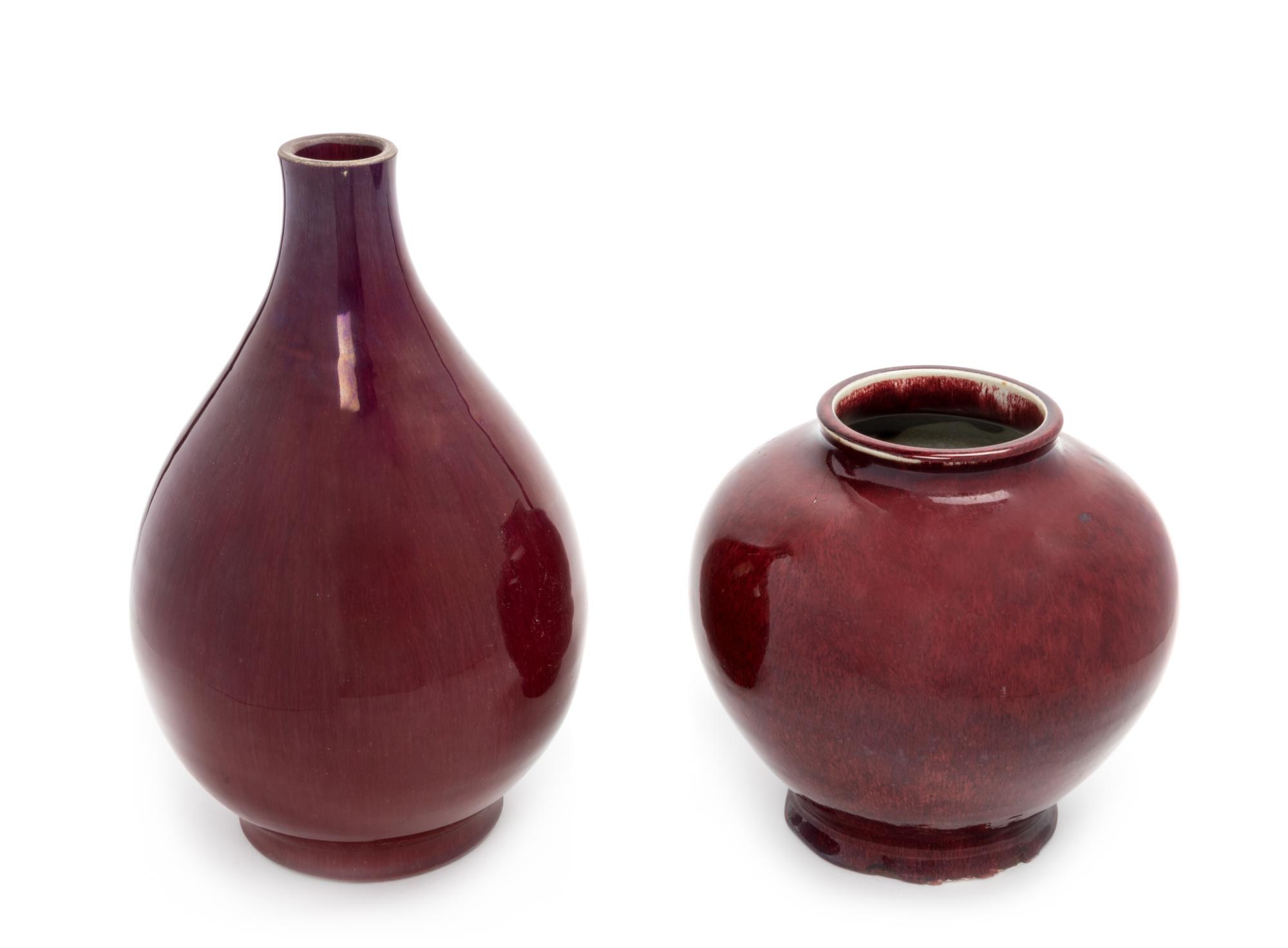 Four Chinese Red Glazed Porcelain Vases Height of largest 16 1/8 inches.