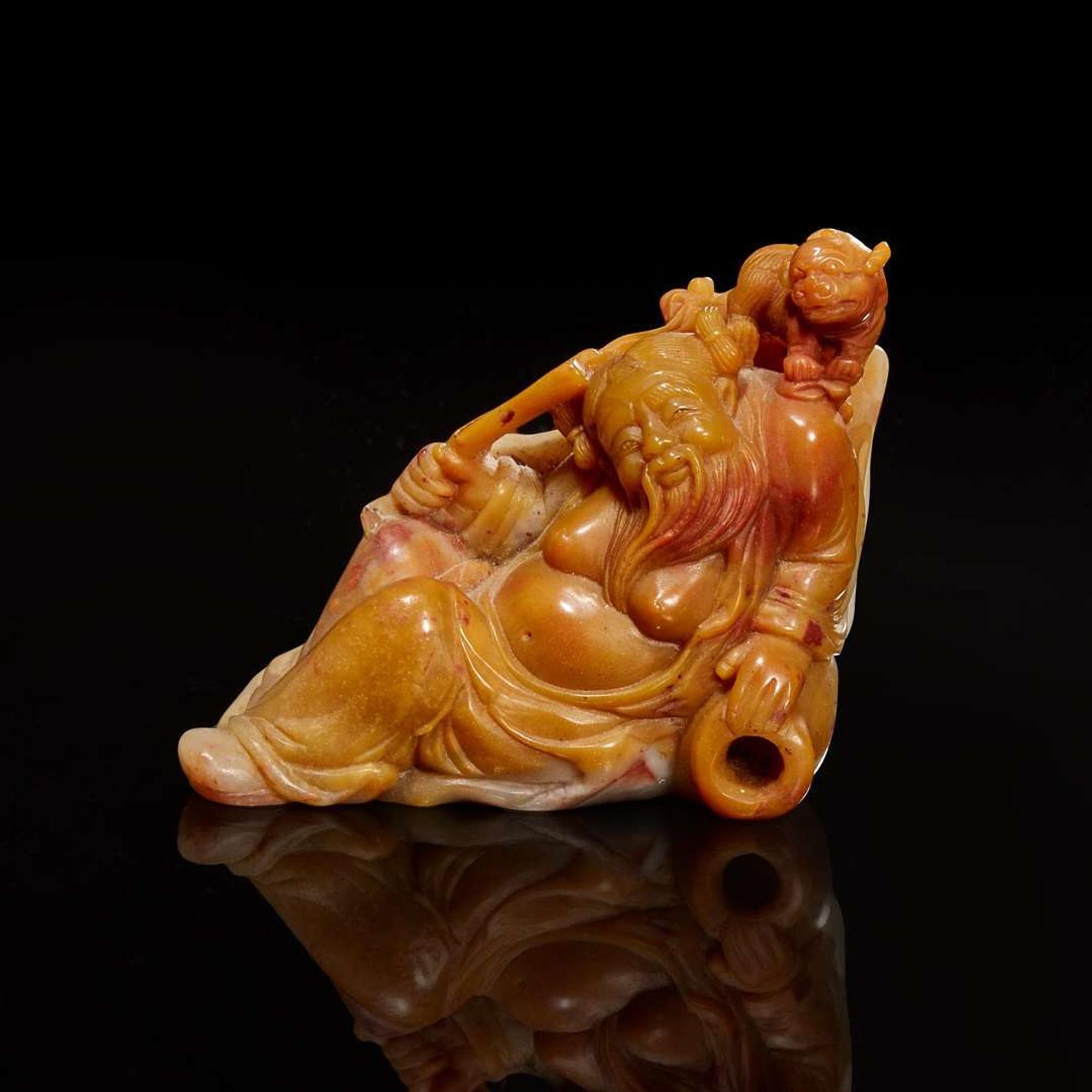 A Chinese carved amber and grey soapstone figure of Li Bai and Lion 壽山石雕李白與小獅
