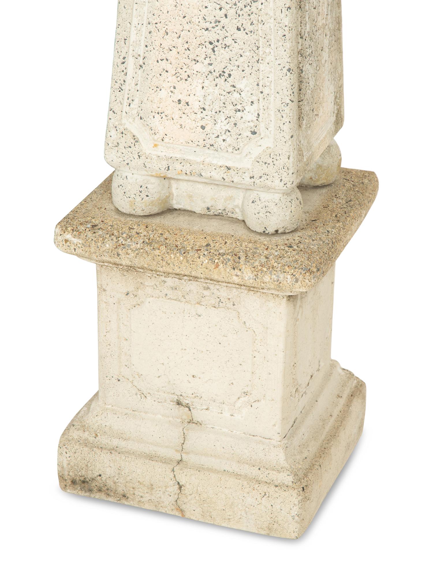 A Set of Four Cast Stone Obelisks