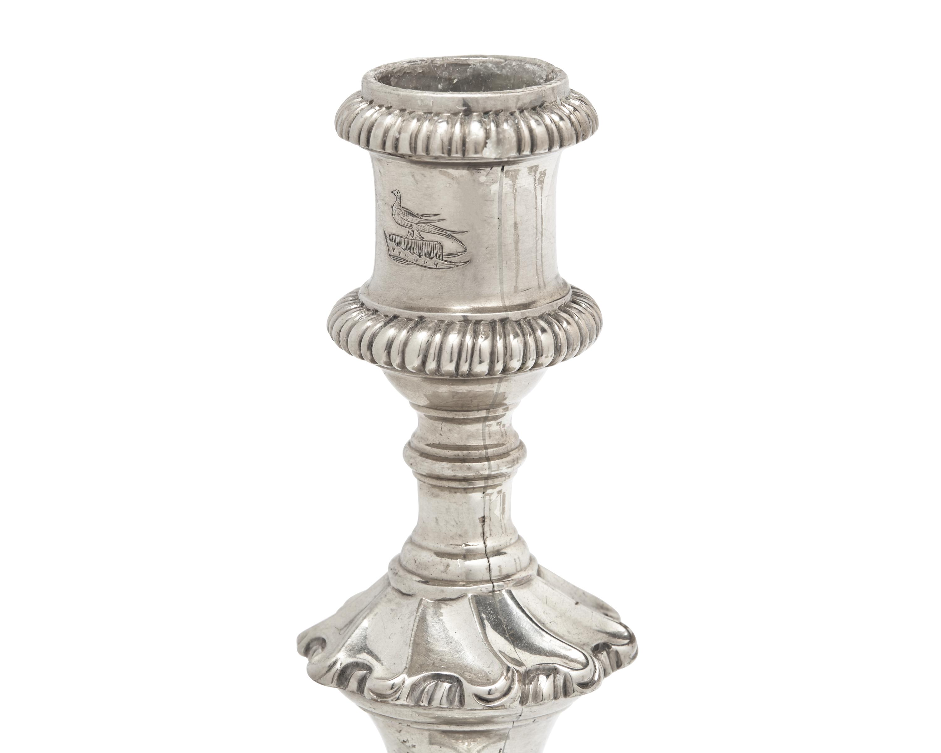 An Assembled Set of George III Sterling Silver Candlesticks