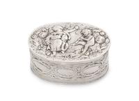 A German Silver Box, 19th/20th Century, of oval form, worked to show figures in relief.