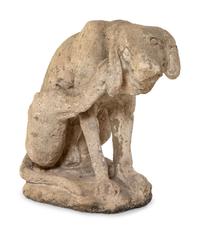 A Limestone Figure of a Seated Dog
