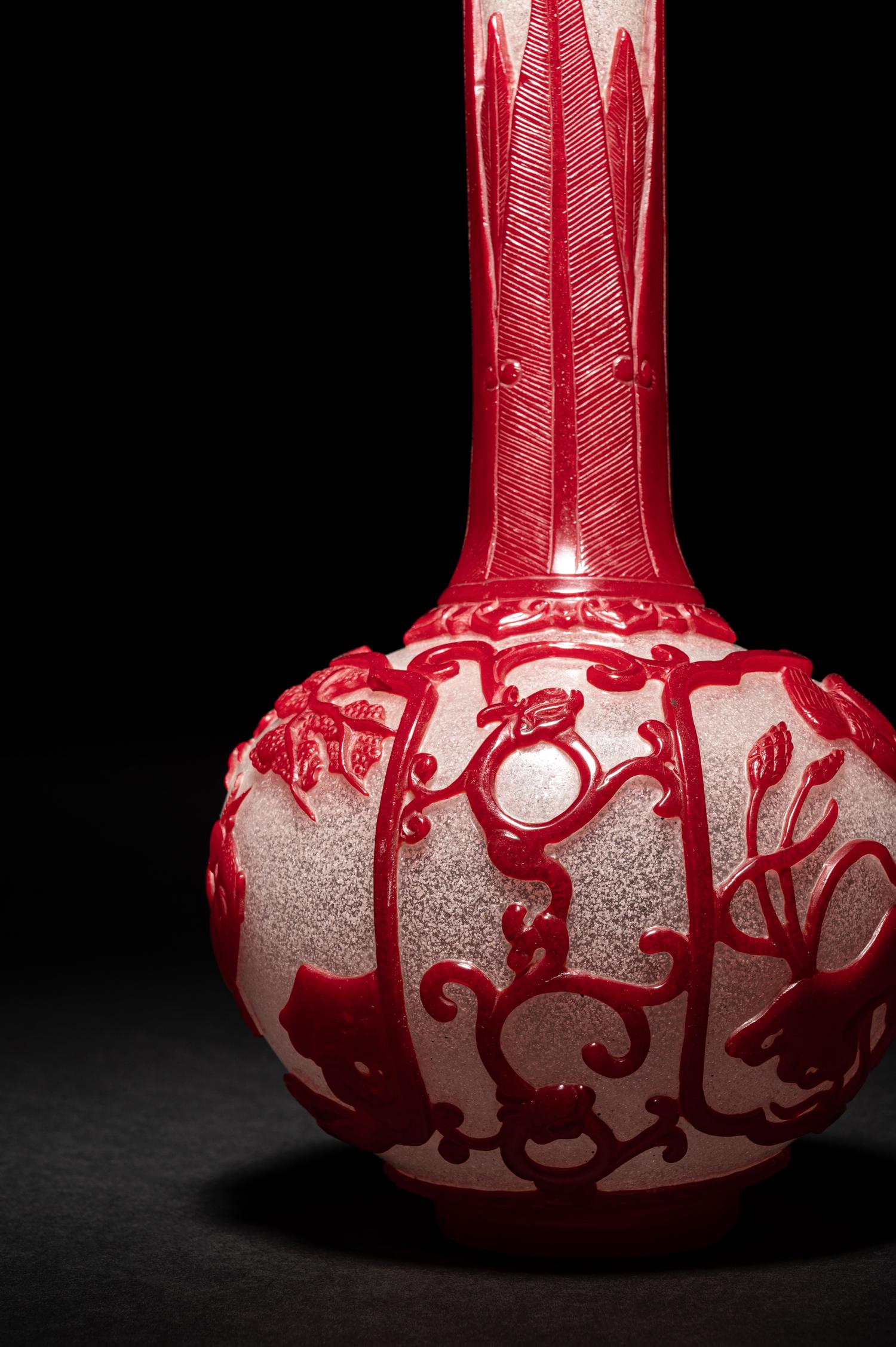 A Chinese Red Overlay Snowflake Ground Peking Glass Bottle Vase