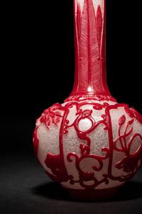 A Chinese Red Overlay Snowflake Ground Peking Glass Bottle Vase