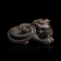A Chinese Patinated Bronze Figure of a Stylized Lion, Late Ming-Early Qing Dynasty — 明末清初 銅獅鎮紙