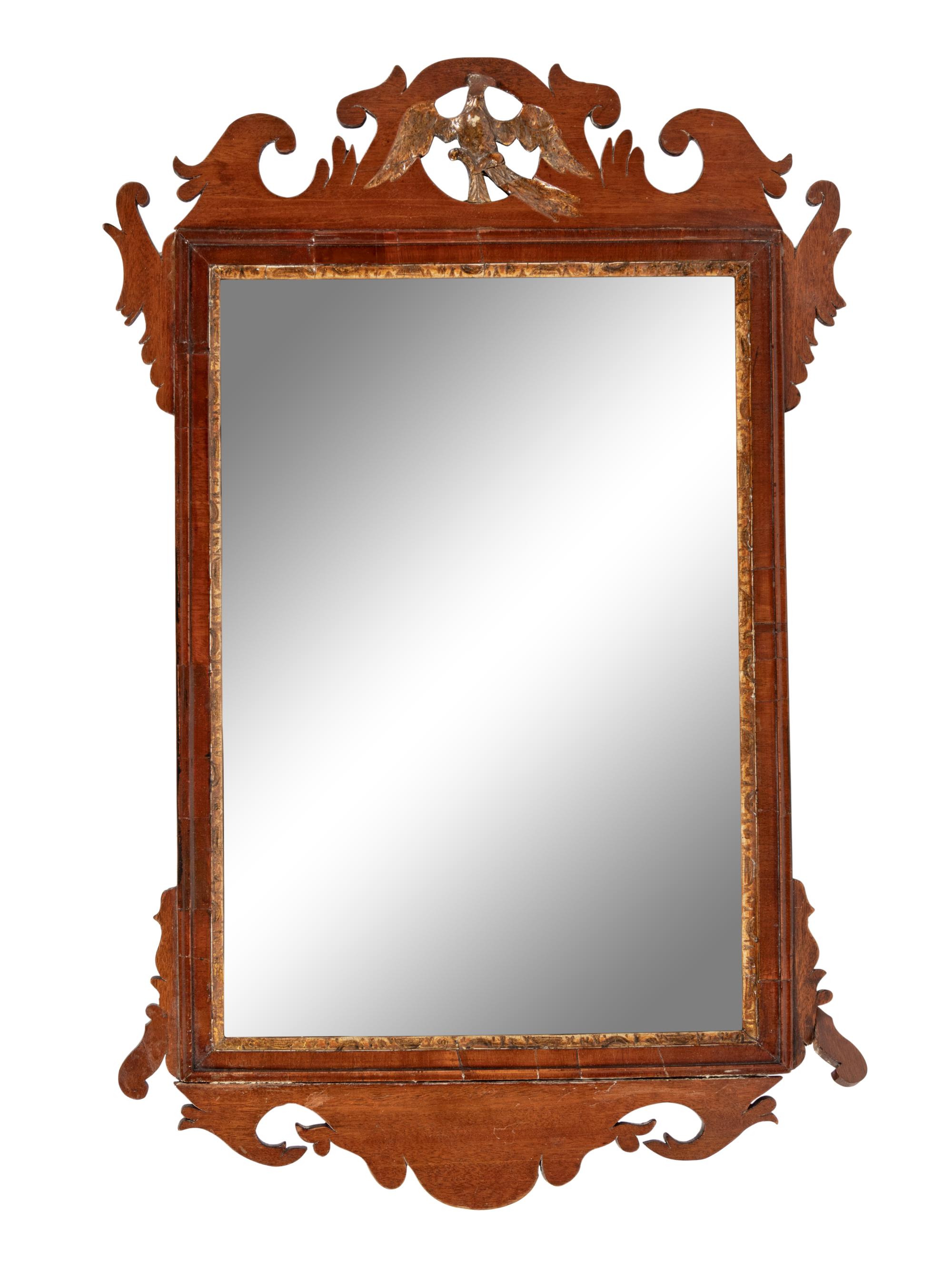 A Chippendale Parcel Gilt and Carved Mahogany Looking Glass