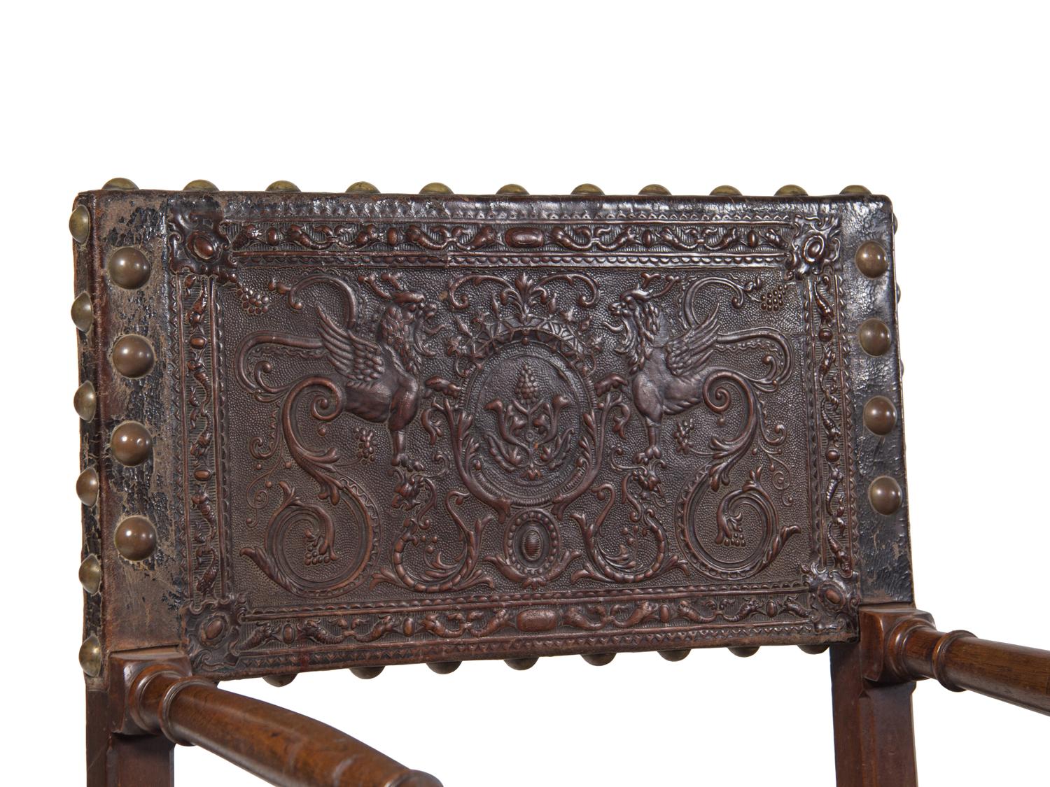 A Spanish Baroque Leather-Upholstered Walnut Armchair