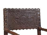 A Spanish Baroque Leather-Upholstered Walnut Armchair