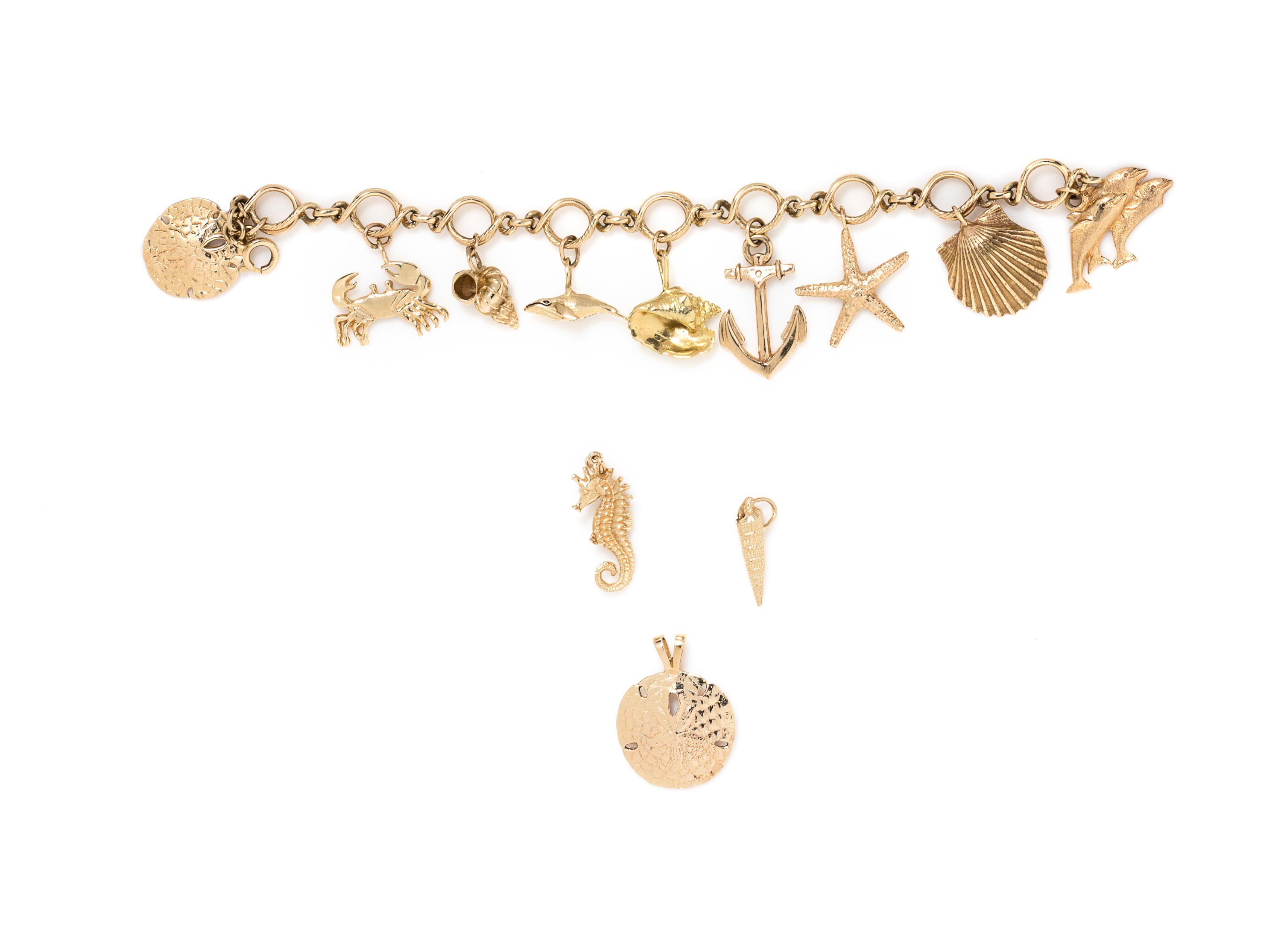 A 14 Karat Yellow Bracelet with 12 Nautical Motif Charms, 45.20 dwts.