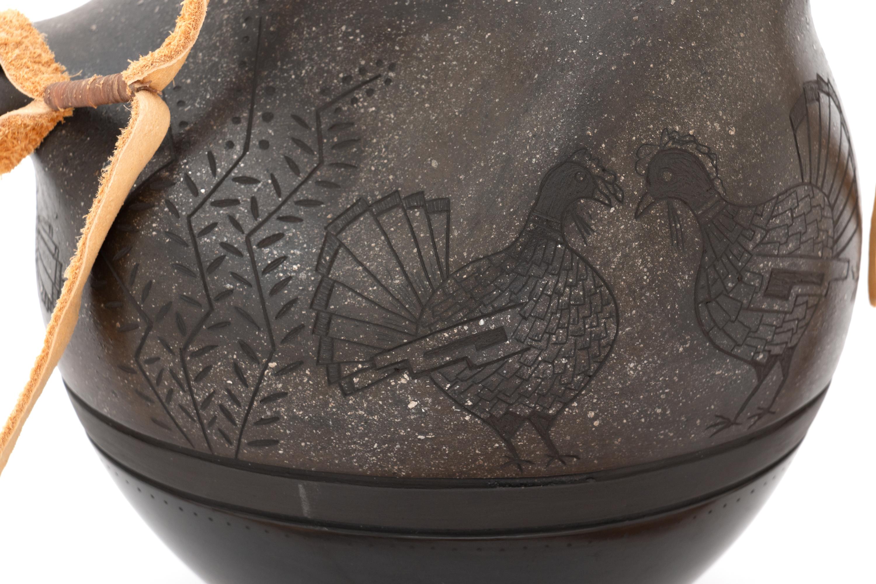 Micaceous Black and Sienna Pottery Canteen, with Sgraffito Decoration