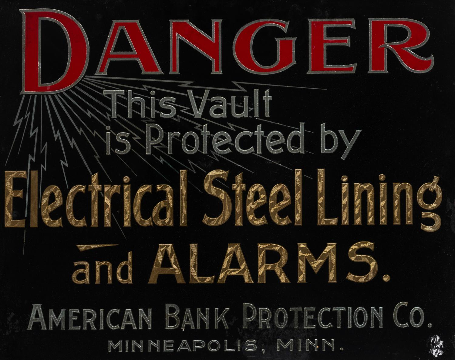 A Parcel Gilt and Reverse Painted Glass American Bank Protection Co. Advertising Sign