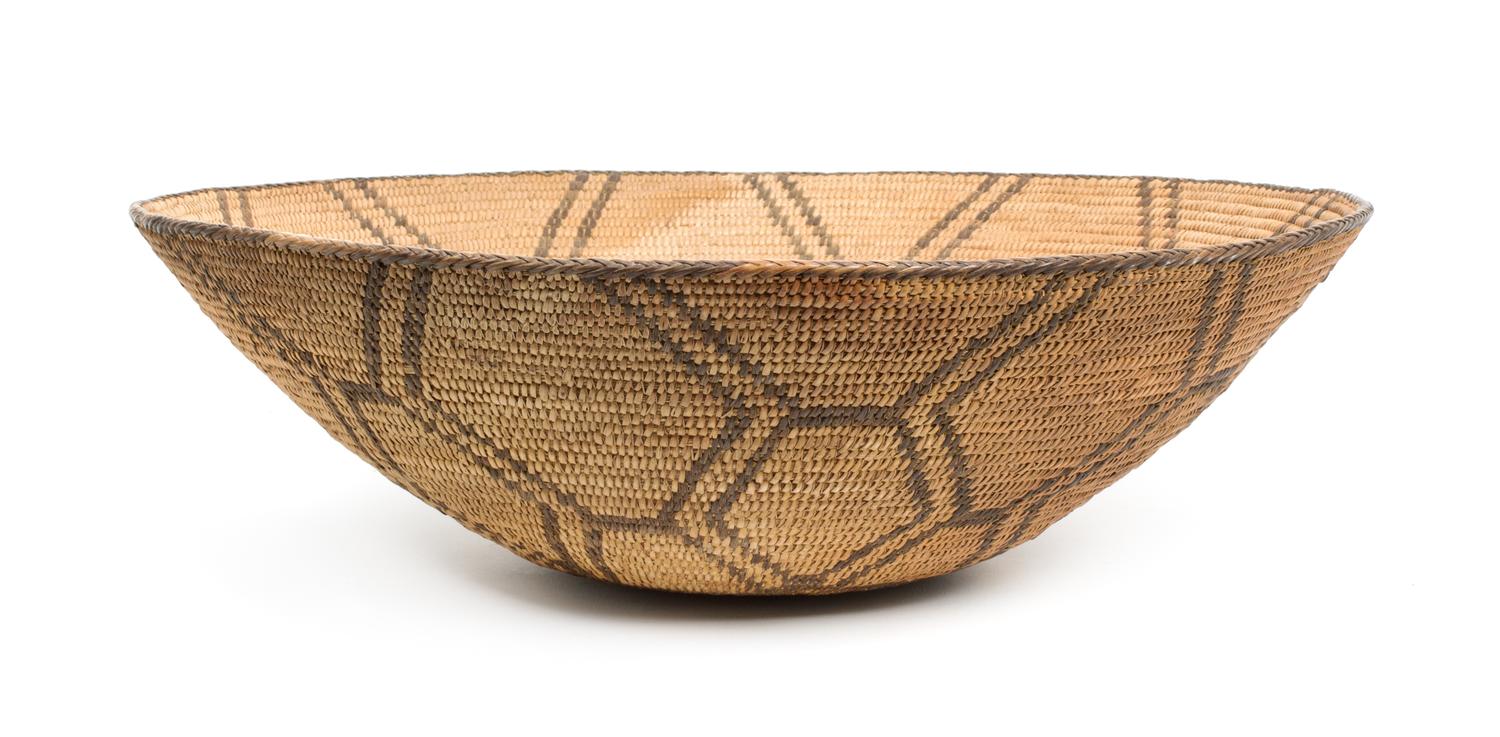 A Pima Basketry Tray Height 5 3/4 x diameter 18 inches.