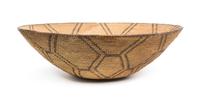 A Pima Basketry Tray Height 5 3/4 x diameter 18 inches.