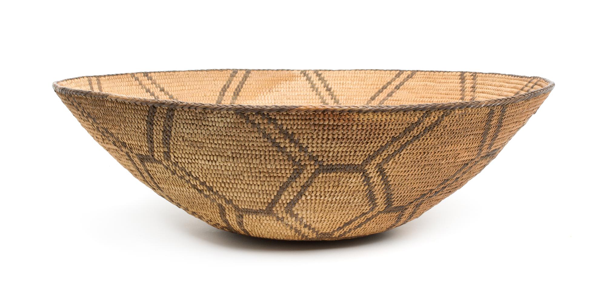 A Pima Basketry Tray Height 5 3/4 x diameter 18 inches.
