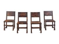 A Set of Four Spanish Baroque Style Oak Chairs with Leather Upholstery