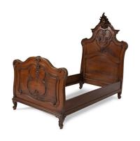 A Pair of American Victorian Carved Mahogany Twin Beds