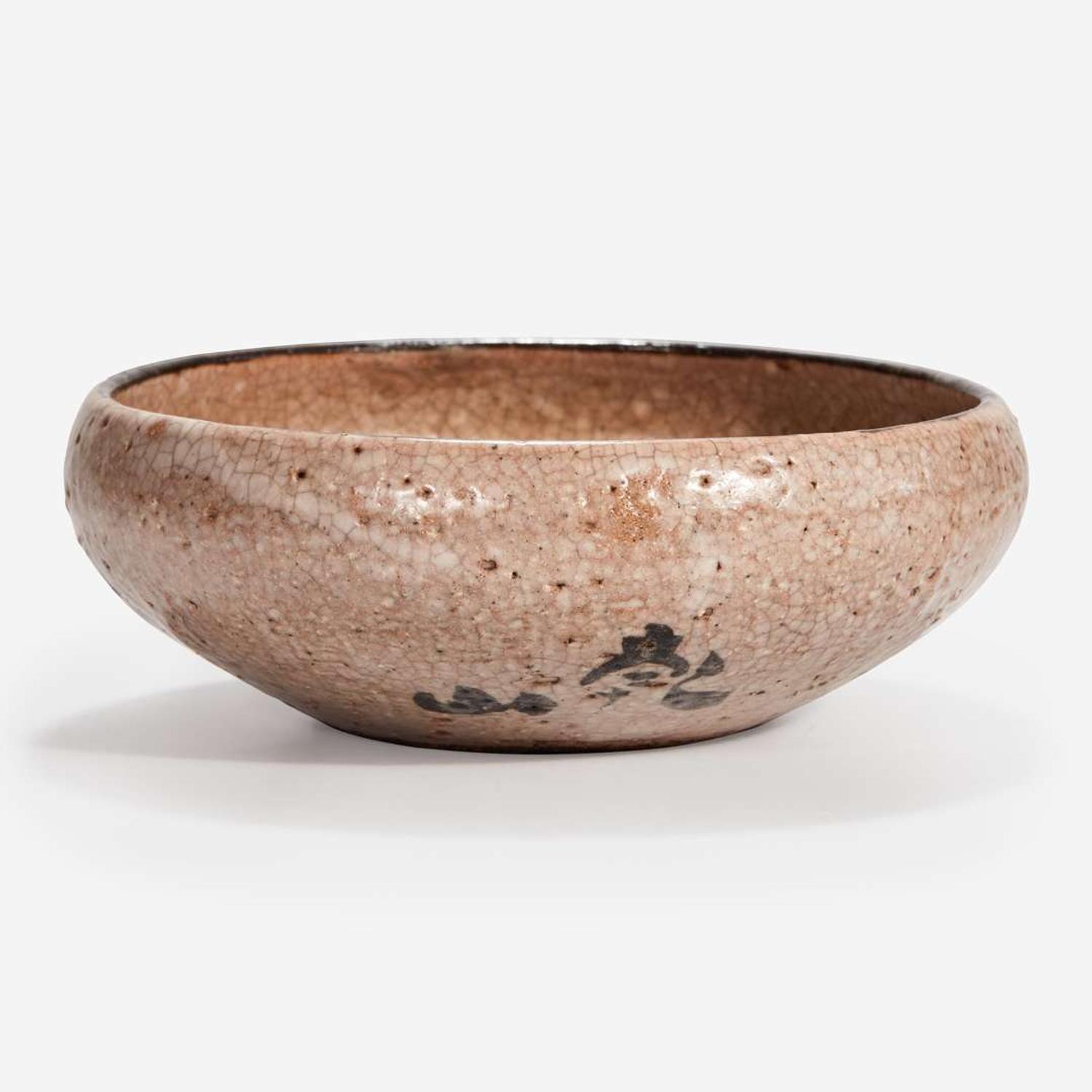 A Japanese iron-brown decorated small stoneware dish Signed "Kenzan"