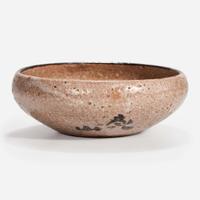 A Japanese iron-brown decorated small stoneware dish Signed "Kenzan"