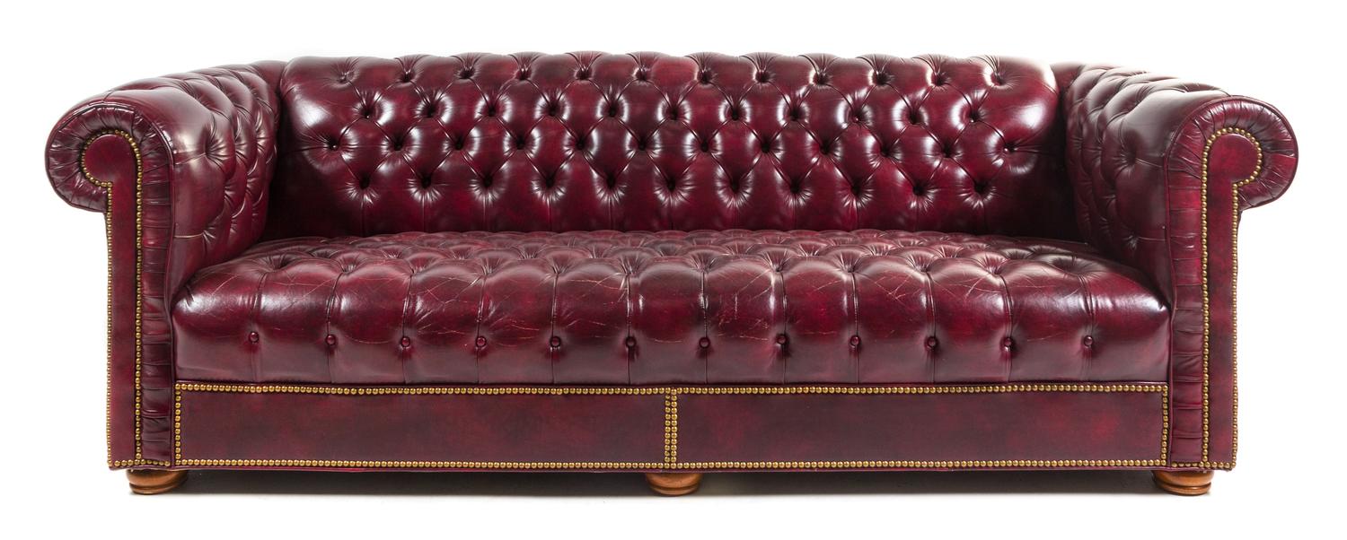 A Faux Leather Upholstered Chesterfield Sofa Height 29 x width 90 x depth 34 inches. — 20TH CENTURY