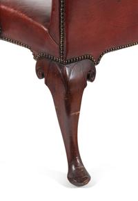 A George II Leather-Upholstered Carved Mahogany Library Chair