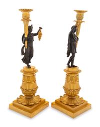 A Pair of Charles X Style Gilt and Patinated Bronze Figural Candlesticks
