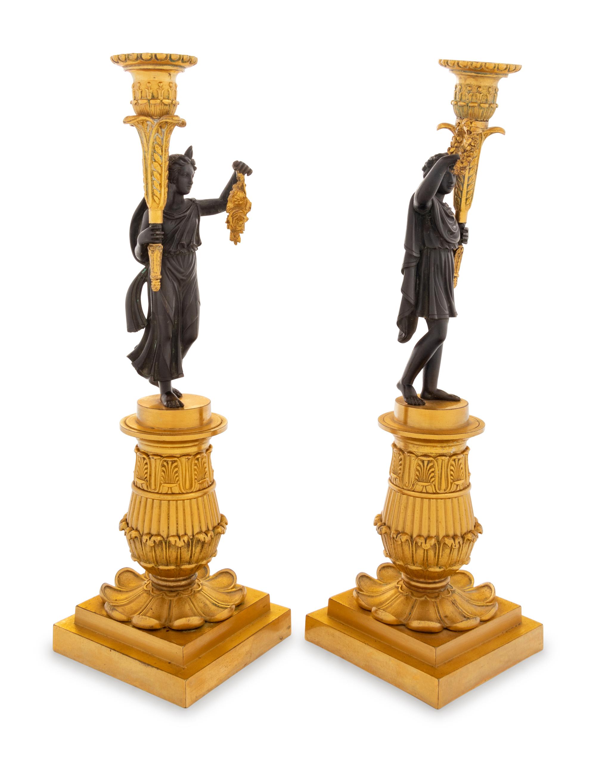 A Pair of Charles X Style Gilt and Patinated Bronze Figural Candlesticks