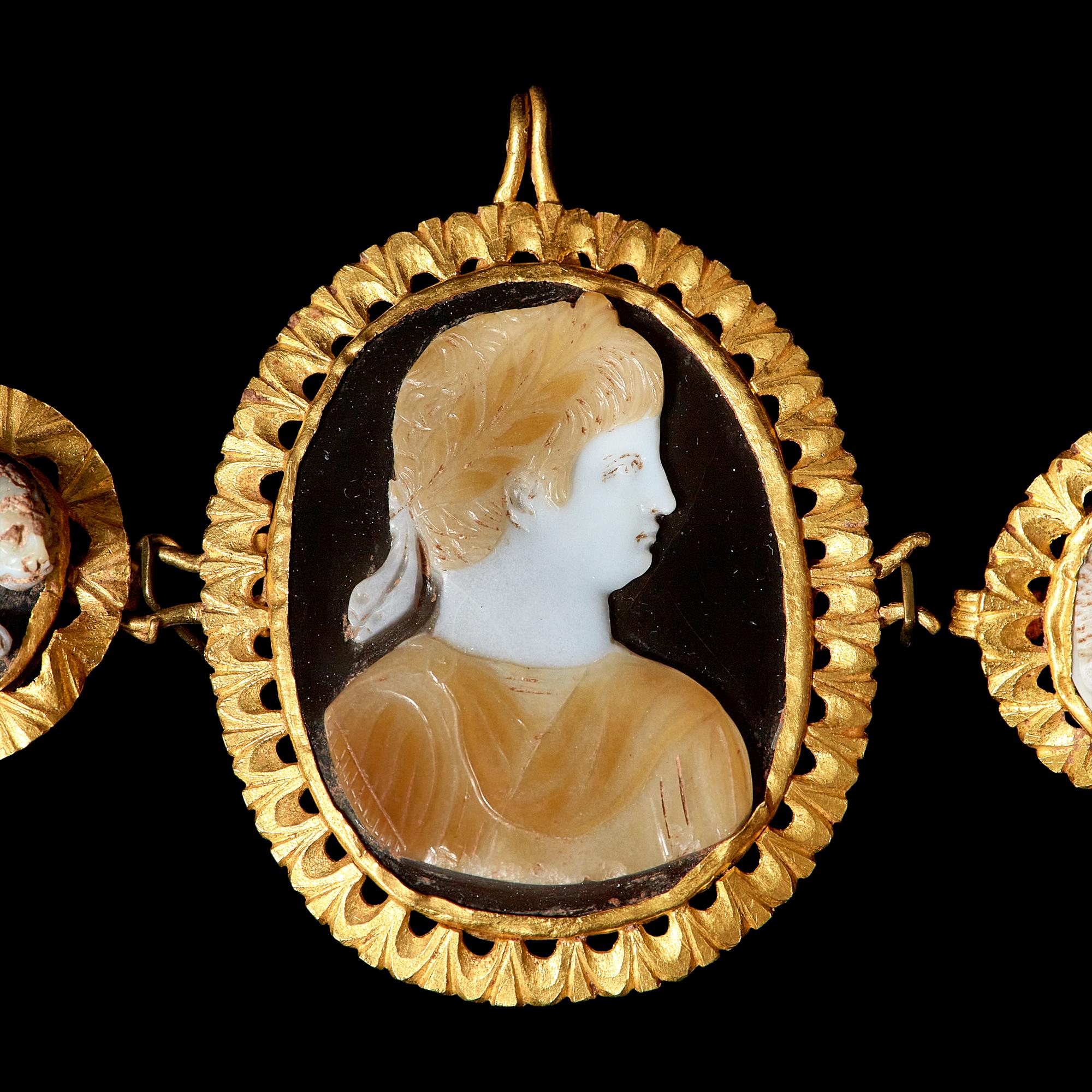 A Trio of Gold-mounted Sardonyx Cameos featuring Nero
