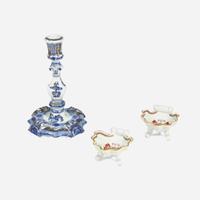 A Chinese Export porcelain blue and white candlestick with gilt decoration and pair of shell-form salts circa 1740-1755
