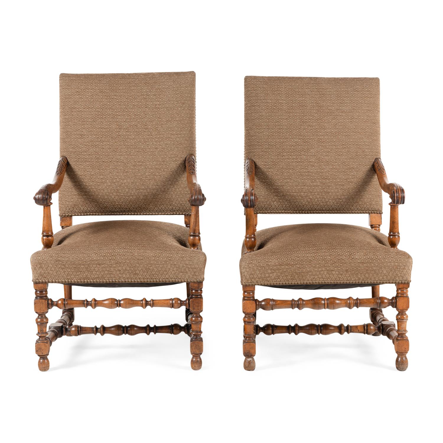 A Near Pair of Continental Baroque Style Walnut Armchairs