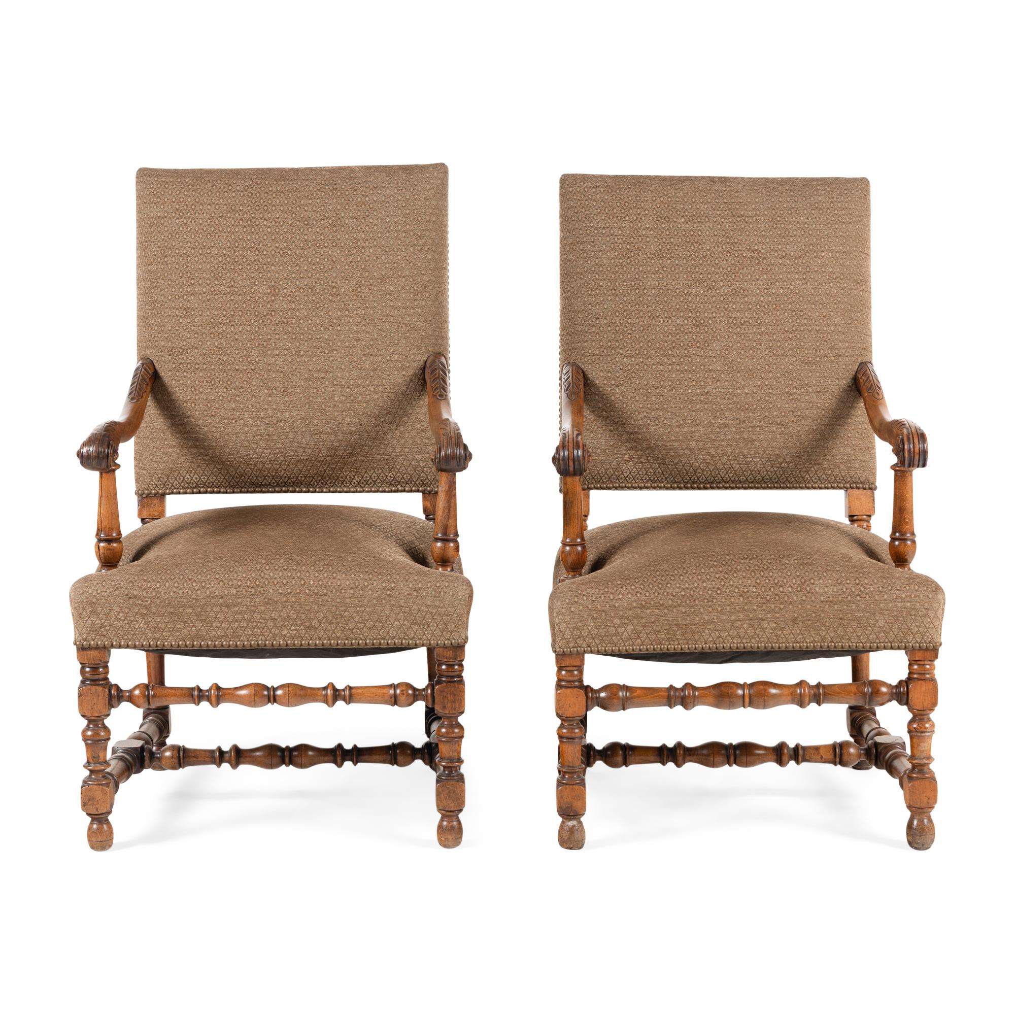 A Near Pair of Continental Baroque Style Walnut Armchairs