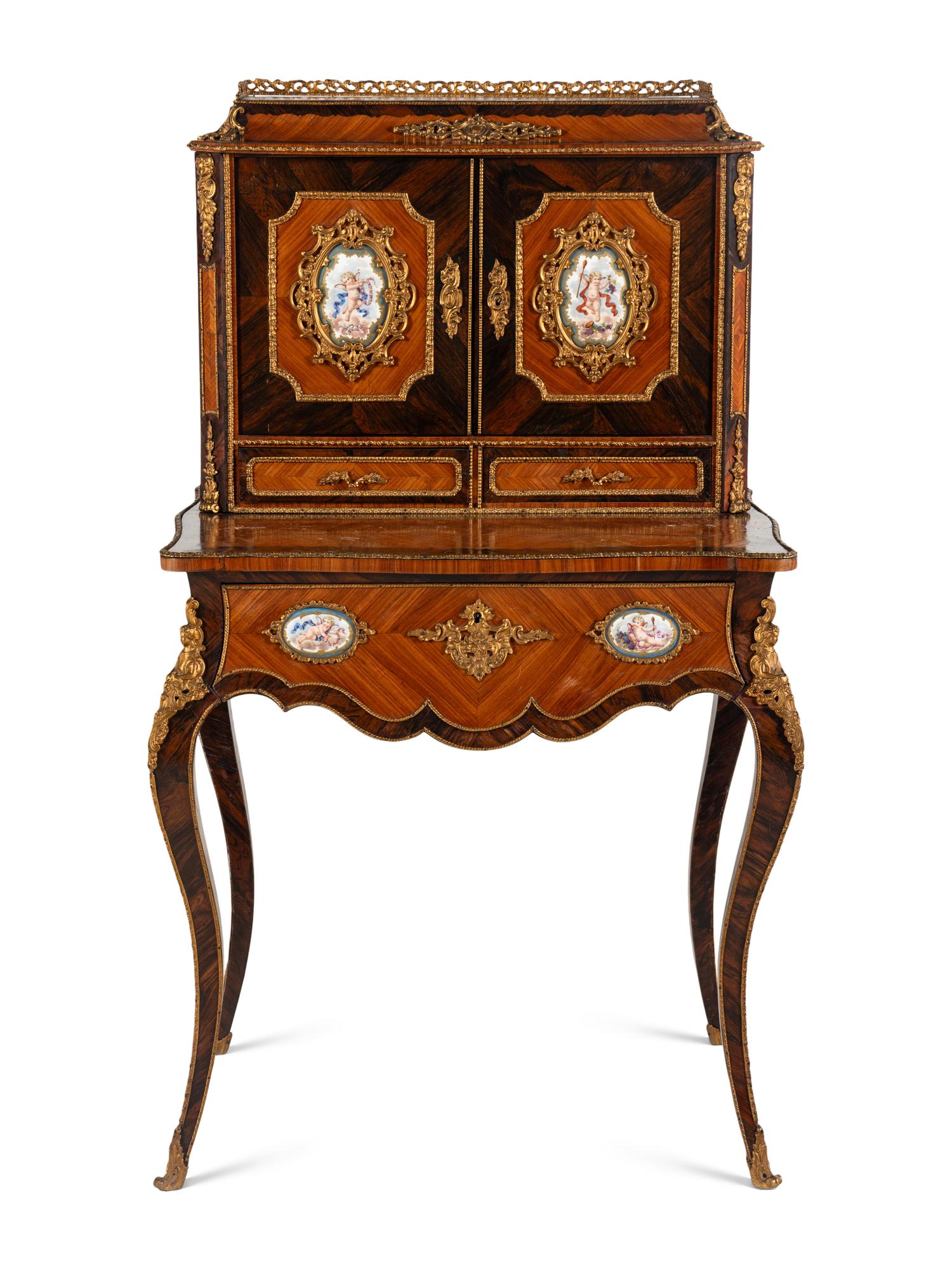 A Napoleon III Gilt Bronze and Porcelain Mounted Kingwood and Rosewood Bonheur du Jour