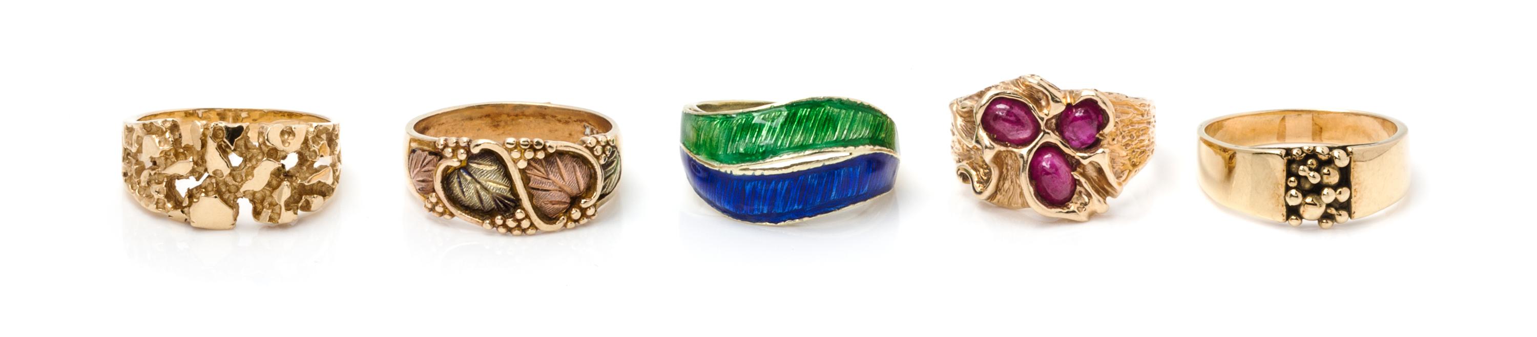 A Collection of Yellow Gold, Ruby and Enamel Rings, 22.40 dwts.