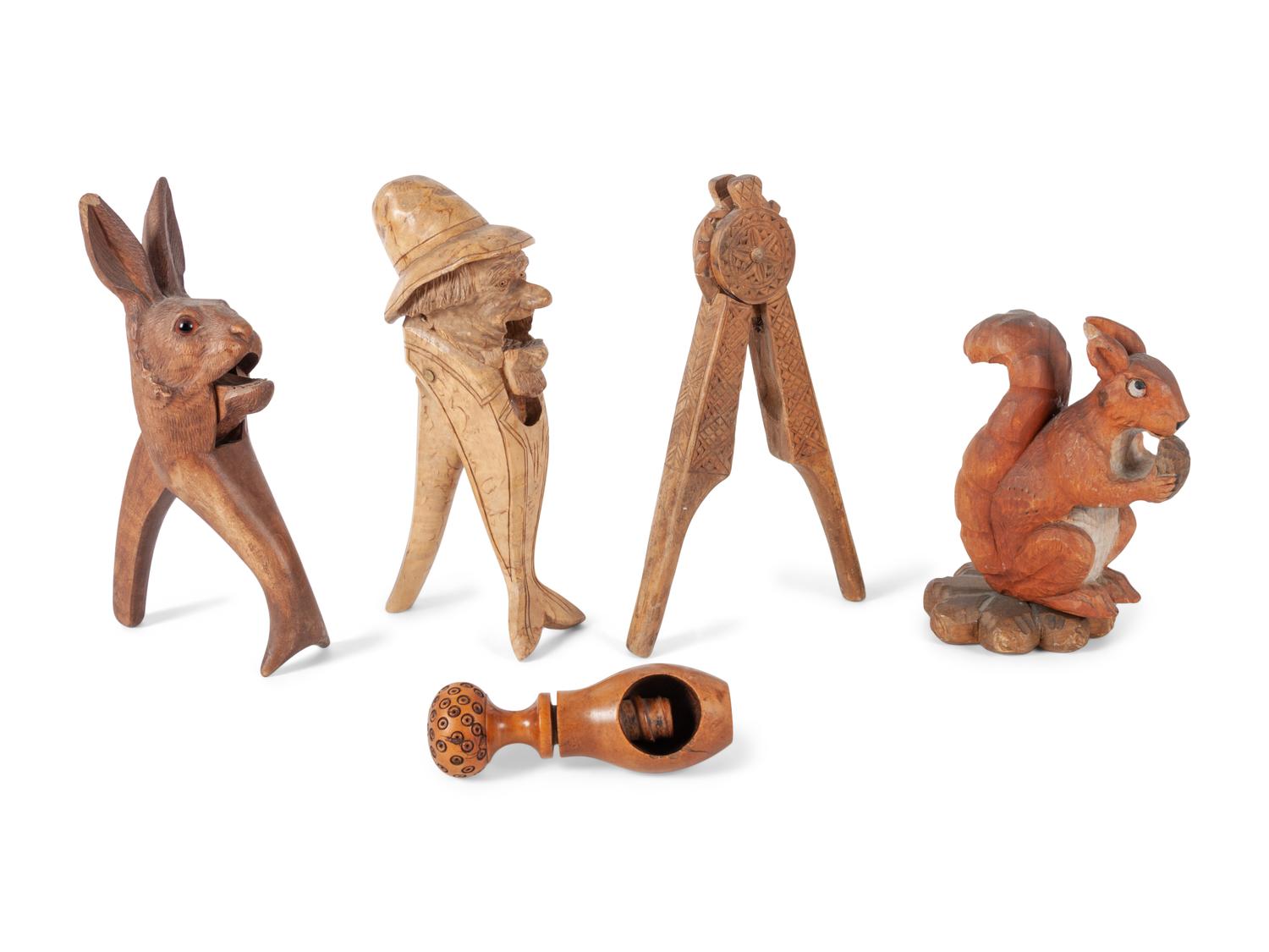 A Collection of Folk Art and Black Forest Carved Nut Crackers