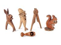 A Collection of Folk Art and Black Forest Carved Nut Crackers