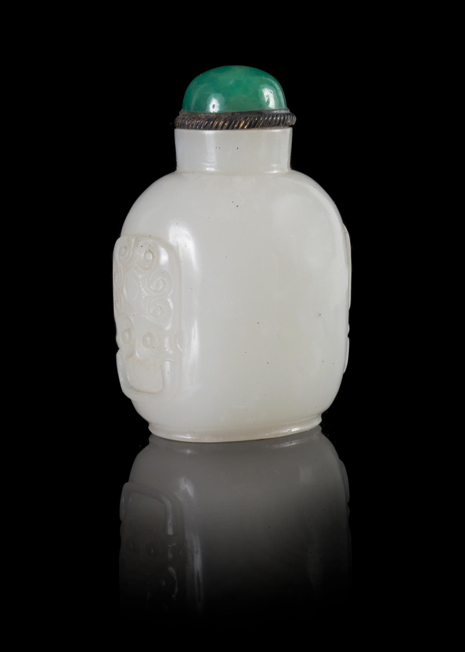 A Glass Imitating White Jade Lion Mask Snuff Bottle Height 3 inches.