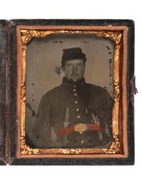 [CIVIL WAR]. Ninth plate ambrotype of Union soldier armed with Bowie knife and pistol.