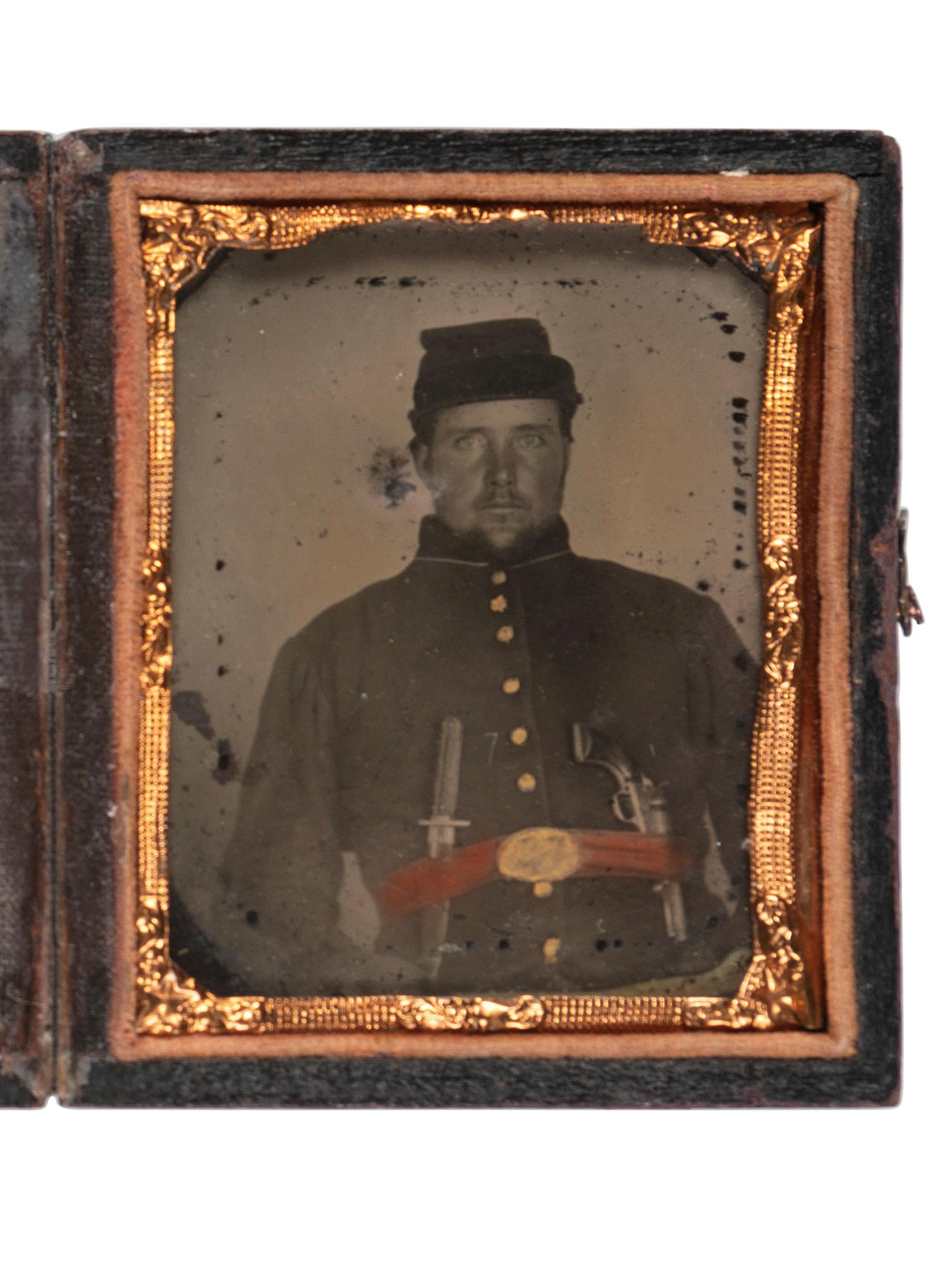[CIVIL WAR]. Ninth plate ambrotype of Union soldier armed with Bowie knife and pistol.
