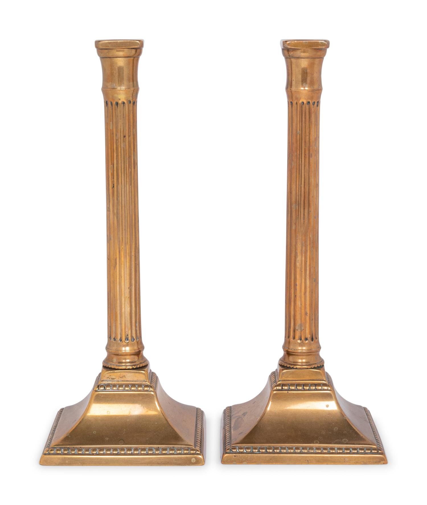 A Pair of George III Bronze Candlesticks
